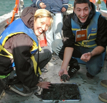 Students doing research on a Great Lakes Center vessel