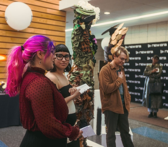 The winning team with their mannequin